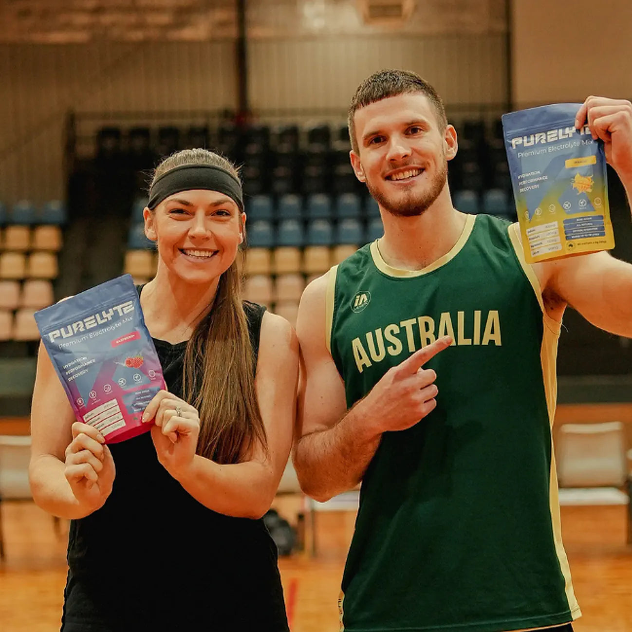 Professional basketball players Teige Morrell and Josh Davey holding Purelyte on a basketball court